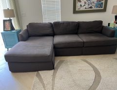 Gray oversized couch with chaise lounger The Villages Florida