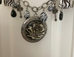‘ROCK AND ROLL’ NECKLACE with CHUNKY SILVER METAL,  BEADS AND CHARMS  $20. The Villages Florida