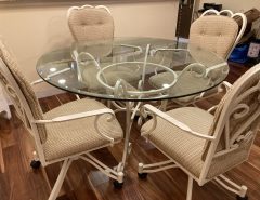 PRICE DROP – MOVING!  Glass Dining Table with 4 chairs (rolling) The Villages Florida