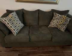 Brown sofa and love seat with pillows The Villages Florida