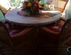 Wicker glass table and four chairs The Villages Florida