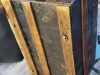 antique-chest-with-wooden-slats-and-hand-made-metal-wheels