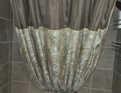 Brown and paisley patterned shower curtain, Liner & hooks. Asking $15 The Villages Florida