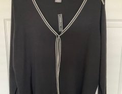 New with store tags…Black and white womens size 18-20 Cardigan sweater $8. The Villages Florida