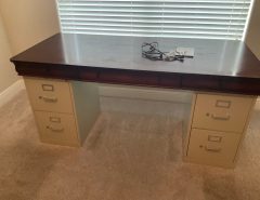 Makeshift Office desk … a nice solid wood desk top sitting on two file cabinets.   $75. The Villages Florida